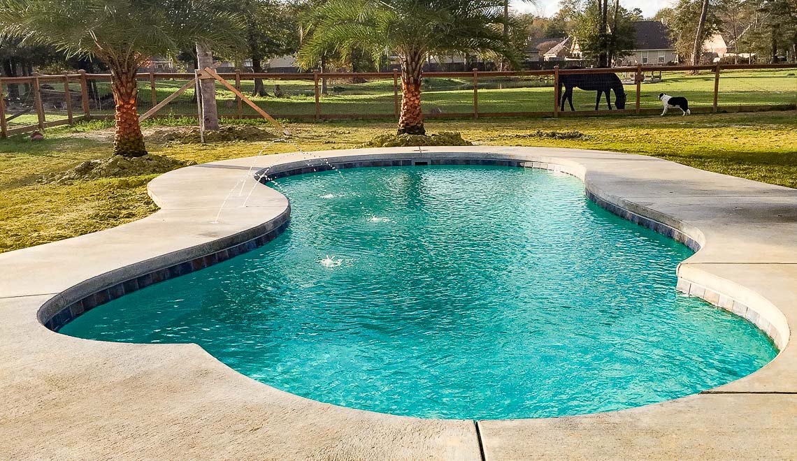 Leisure Pools Eclipse composite fiberglass swimming pool with built-in splash deck