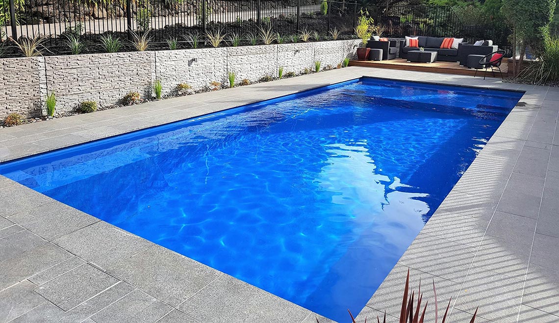 Leisure Pools Acclaim composite fibreglass swimming pool in Sapphire Blue