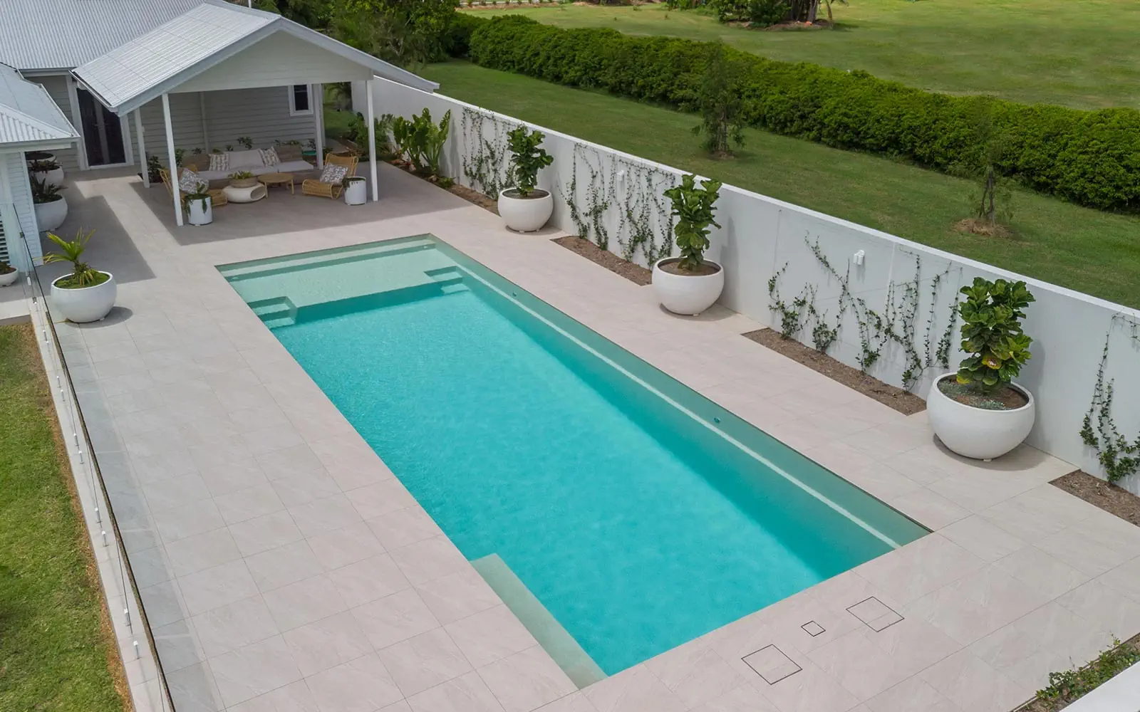 THe Acclaim fibreglass swimming pool with splash deck