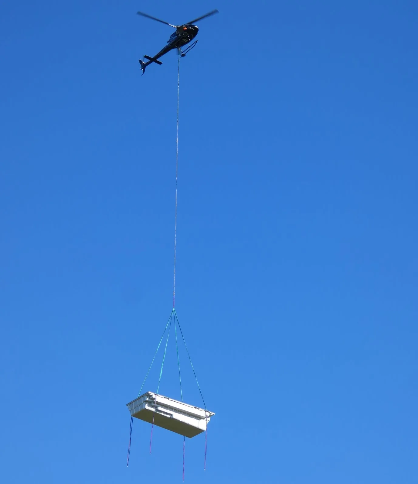 NZ Pools helicopter lifting a Leisure Pools to install